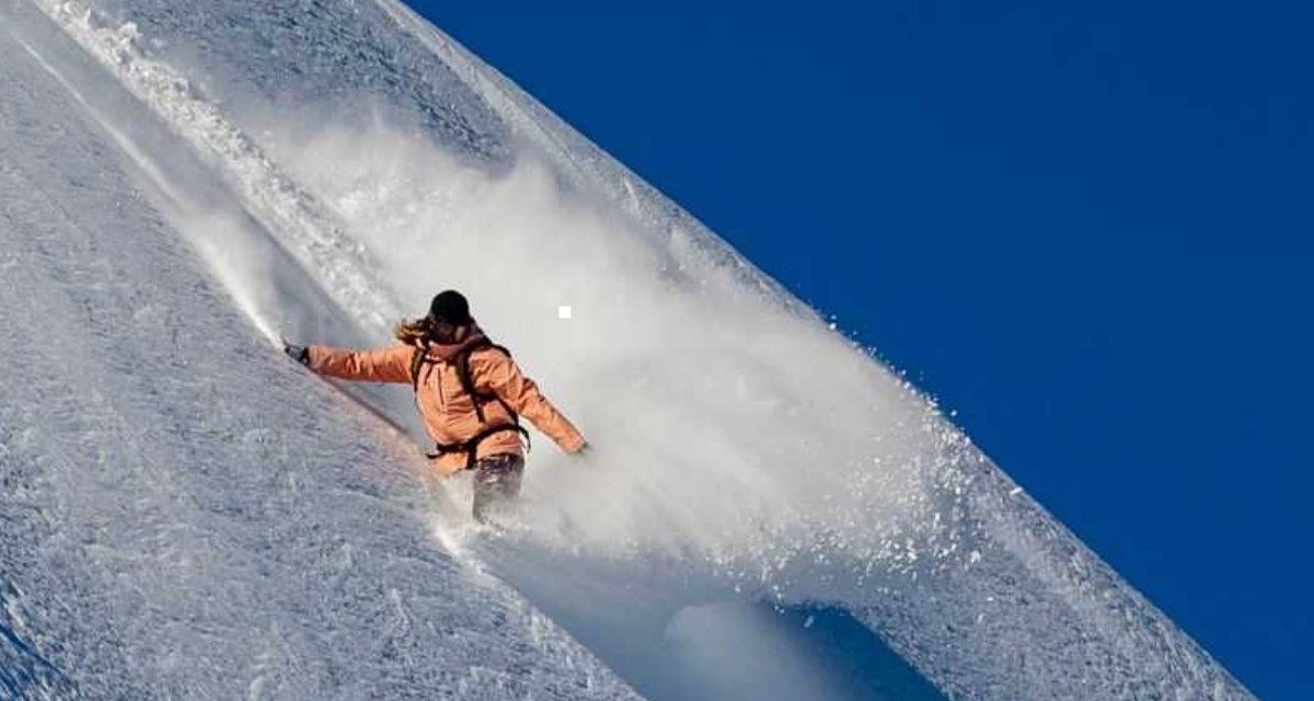 686 skier on a steep slope