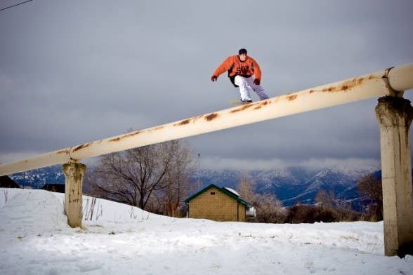 Marc Frank Montoya (MFM) on a snowboard rail