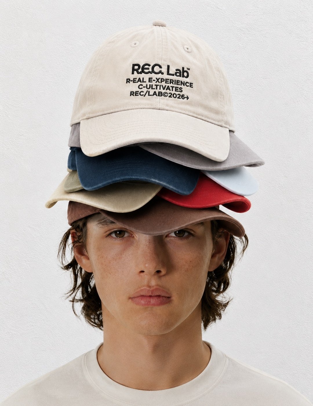 Stacked RECLAB caps worn by a model