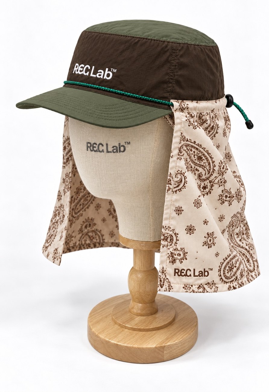 RECLAB ripstop cap with paisley sun shade on a display head